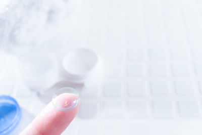 Close-up of hand holding glass