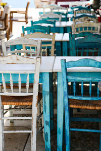 Empty chairs and tables in restaurant