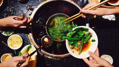 Close-up of hands eating food