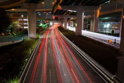 Light trails on road in city at night