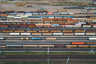 A large marshalling yard filled with freight trains in a horizontal pattern