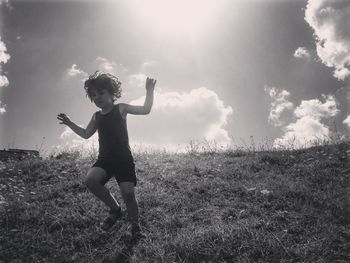 Full length of girl on field against sky