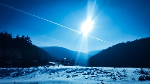 Scenic view of snowcapped mountains against sky during winter