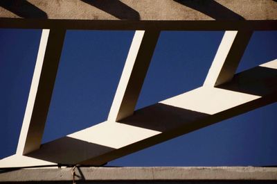 Low angle view of building against clear blue sky