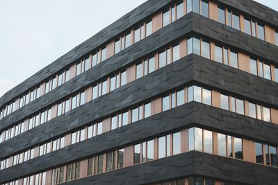 Low angle view of modern building against sky