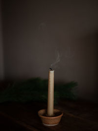 Close-up of candle on table