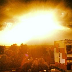 Sun shining over city