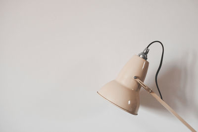 Close-up of lamp over white background