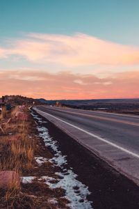 Road against sky during sunset