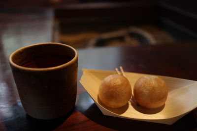 Close-up of cup and coffee on table