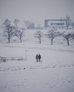 Man standing on snow covered field