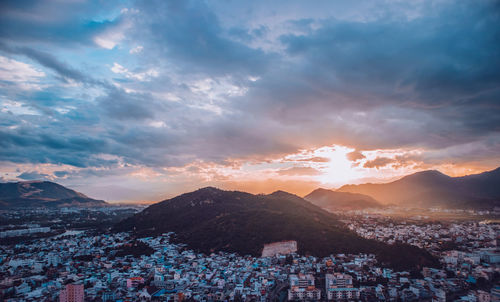 Aerial view of townscape against sky during sunset