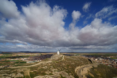 High angle view of city against cloudy sky