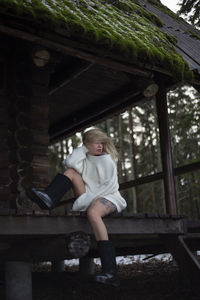 Young woman sitting on bench