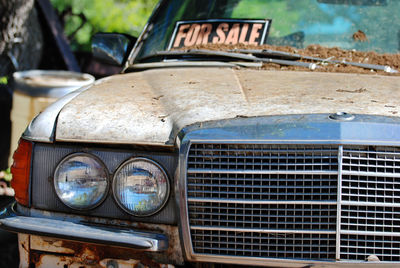 Close-up of abandoned car