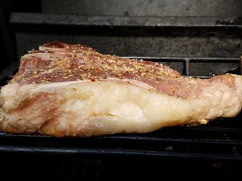 Close-up of meat on barbecue grill