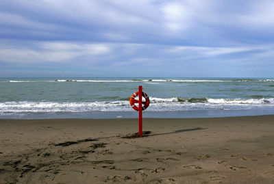 Lonely view of the sea in winter with a lifebuoy in the foreground