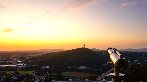 Scenic view of cityscape against sky during sunset