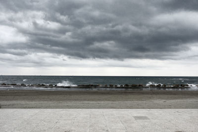 Scenic view of sea against cloudy sky