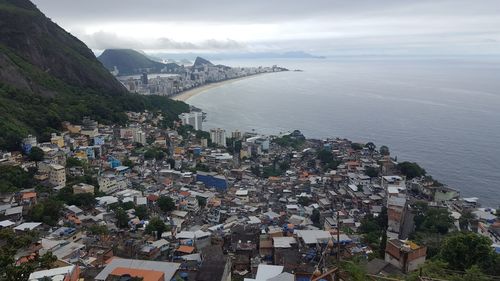 High angle view of townscape by sea