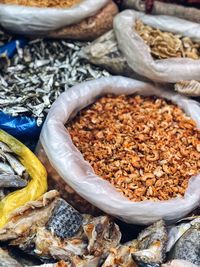 Close-up of dried fish for sale at market stall