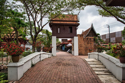 Street amidst buildings against sky