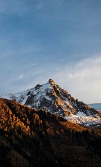 Scenic view of snowcapped mountain against sky