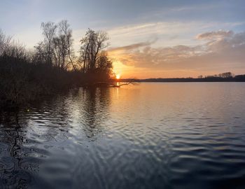 Scenic view of lake against sky during sunset
