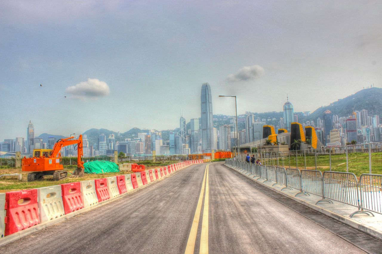 building exterior, architecture, built structure, sky, city, the way forward, cloud - sky, cityscape, road, transportation, diminishing perspective, cloudy, residential building, cloud, street, railing, residential district, residential structure, building, vanishing point