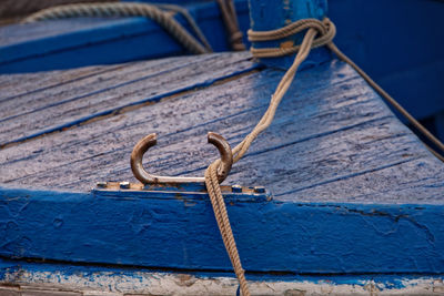 High angle view of rope tied on wood