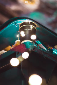 Close-up of illuminated lighting equipment on table