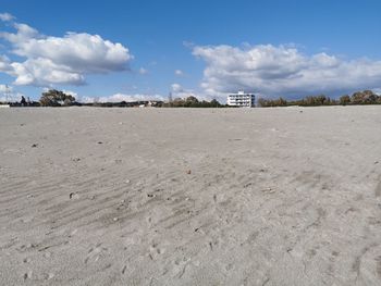 Surface level of beach against sky