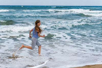 Full length of woman on beach