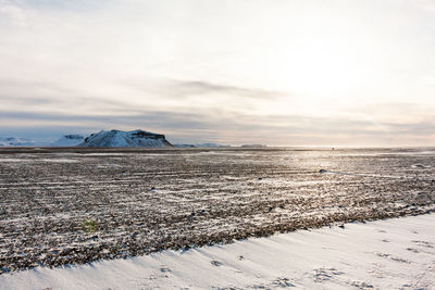 Scenic view of sea against sky during winter