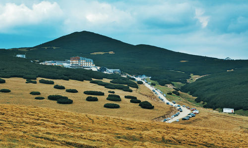 Scenic view of agricultural field against sky