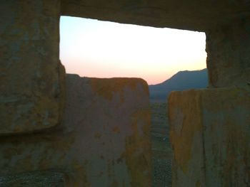 Old ruins against sky during sunset