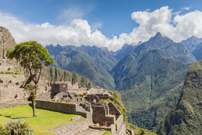 Scenic view of fort in mountains against cloudy sky