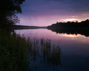 Scenic view of lake against sky during sunset
