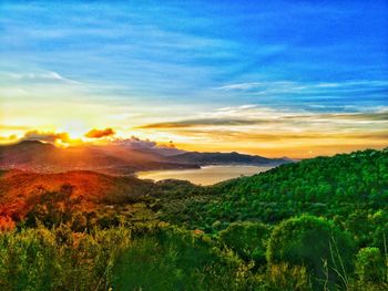 Scenic view of landscape against sky during sunset