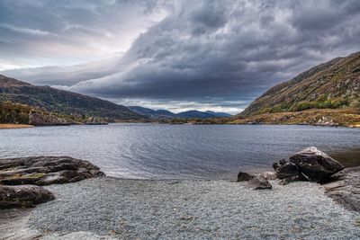 Scenic view of lake and mountains against sky
