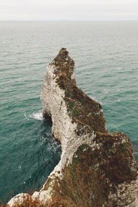 High angle view of rock on beach against sky