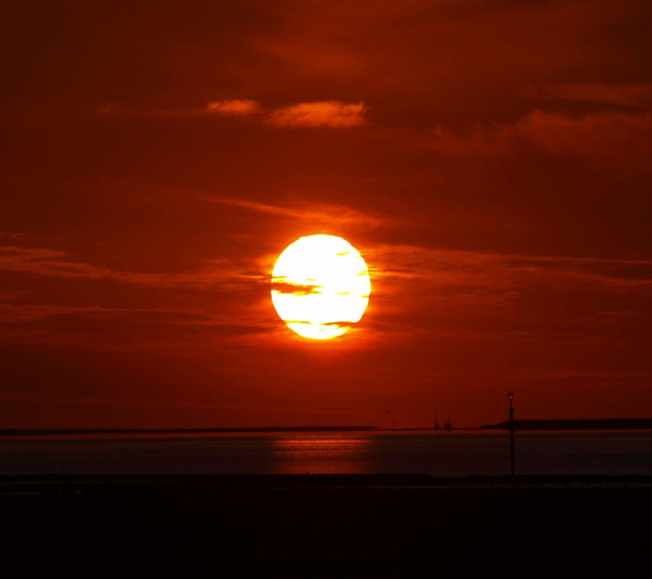 sunset, orange color, sun, scenics, sky, beauty in nature, tranquil scene, tranquility, sea, silhouette, horizon over water, idyllic, nature, cloud - sky, water, dramatic sky, cloud, sunlight, outdoors, no people