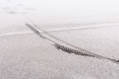 Close-up of snow on sand