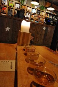 Glass of bottles on table in restaurant