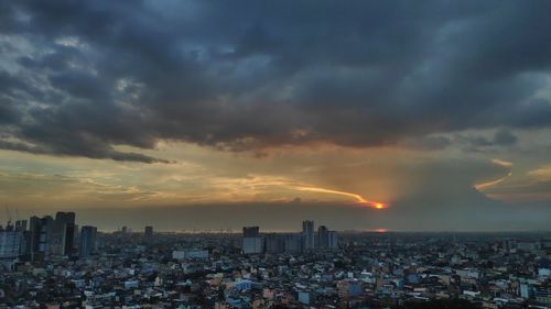 Cityscape against sky during sunset