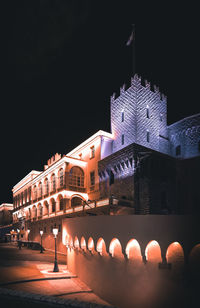 Illuminated buildings in city at night