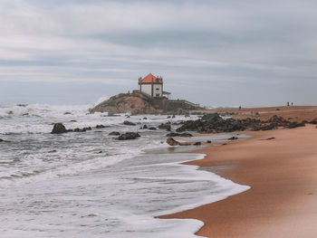 Scenic view of beach against sky