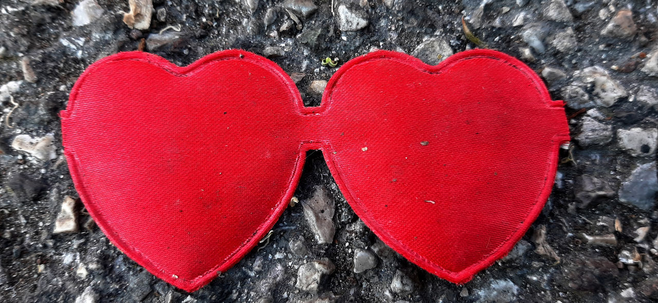 DIRECTLY ABOVE SHOT OF RED HEART SHAPE MADE ON WALL