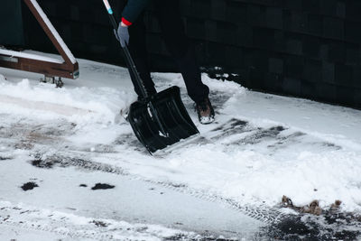 Low section of person skiing on snow