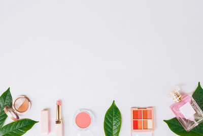 High angle view of beauty products on white background